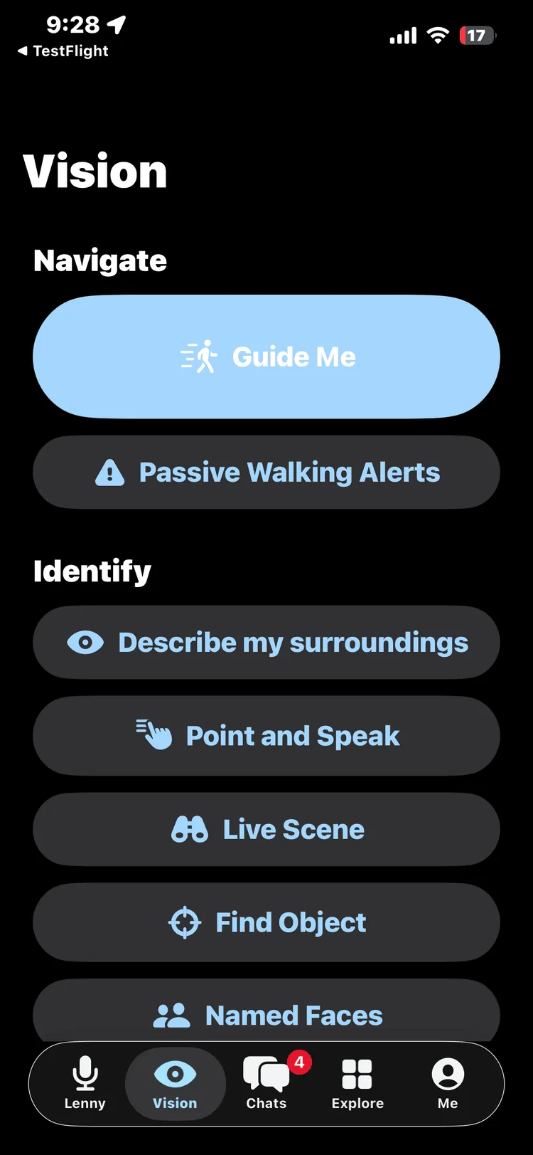 Real TestFlight screenshot of the ChatLemur app's Vision tab on iPhone, dark layout with large high-contrast buttons in two sections: Navigate, with a prominent light-blue Guide Me button and Passive Walking Alerts below it, and Identify, with Describe my surroundings, Point and Speak, Live Scene, Find Object and Named Faces. The Lenny, Vision, Chats, Explore and Me tab bar sits at the bottom.